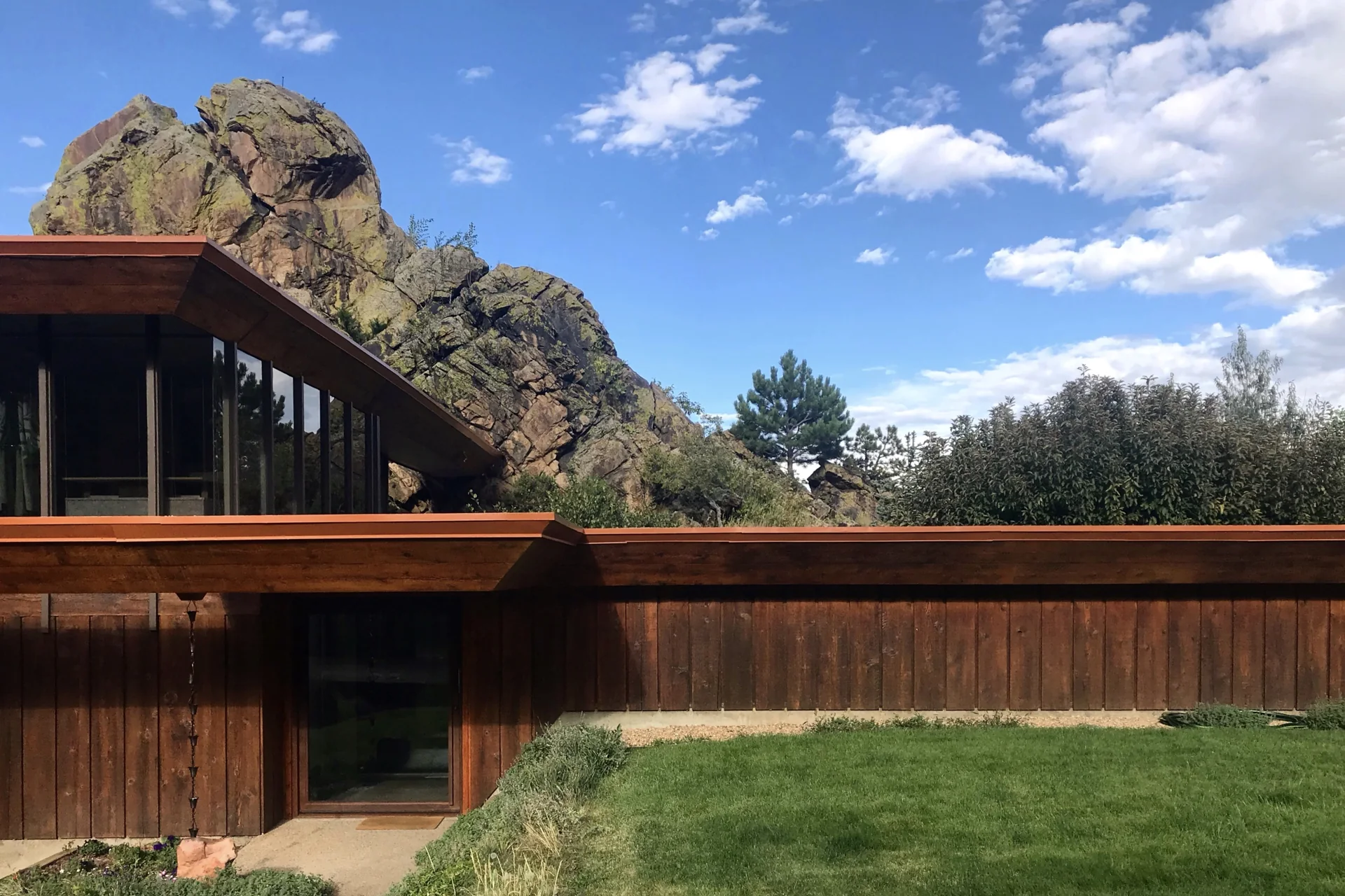 Architecture and rock formations share the landscape.
