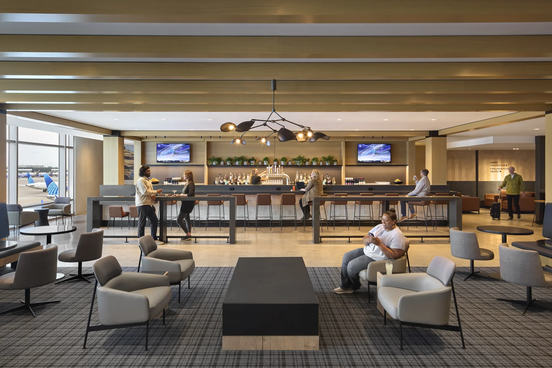 The feature bar anchors a shared gathering space.