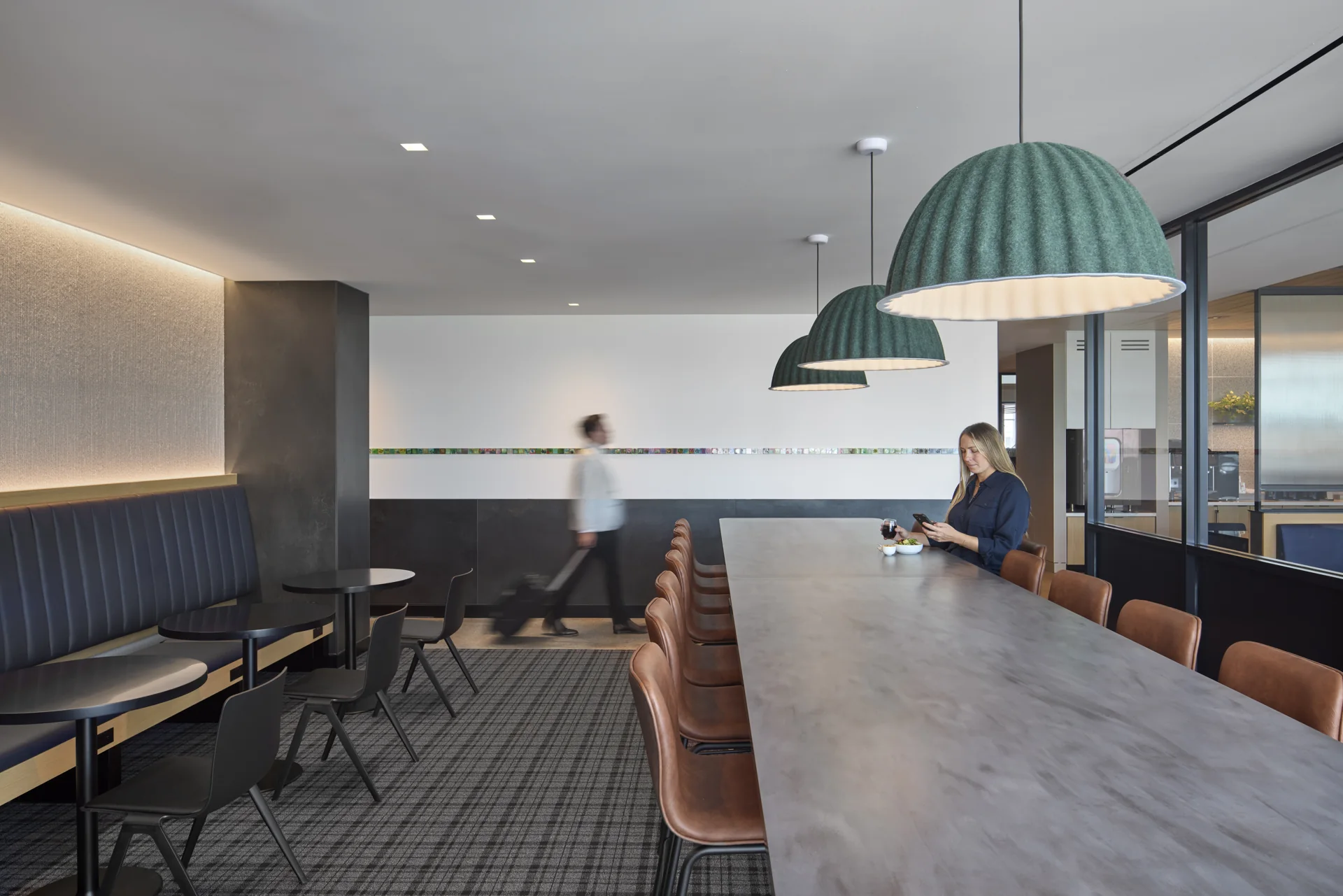 Lighting and seating create smaller moments within the larger club.