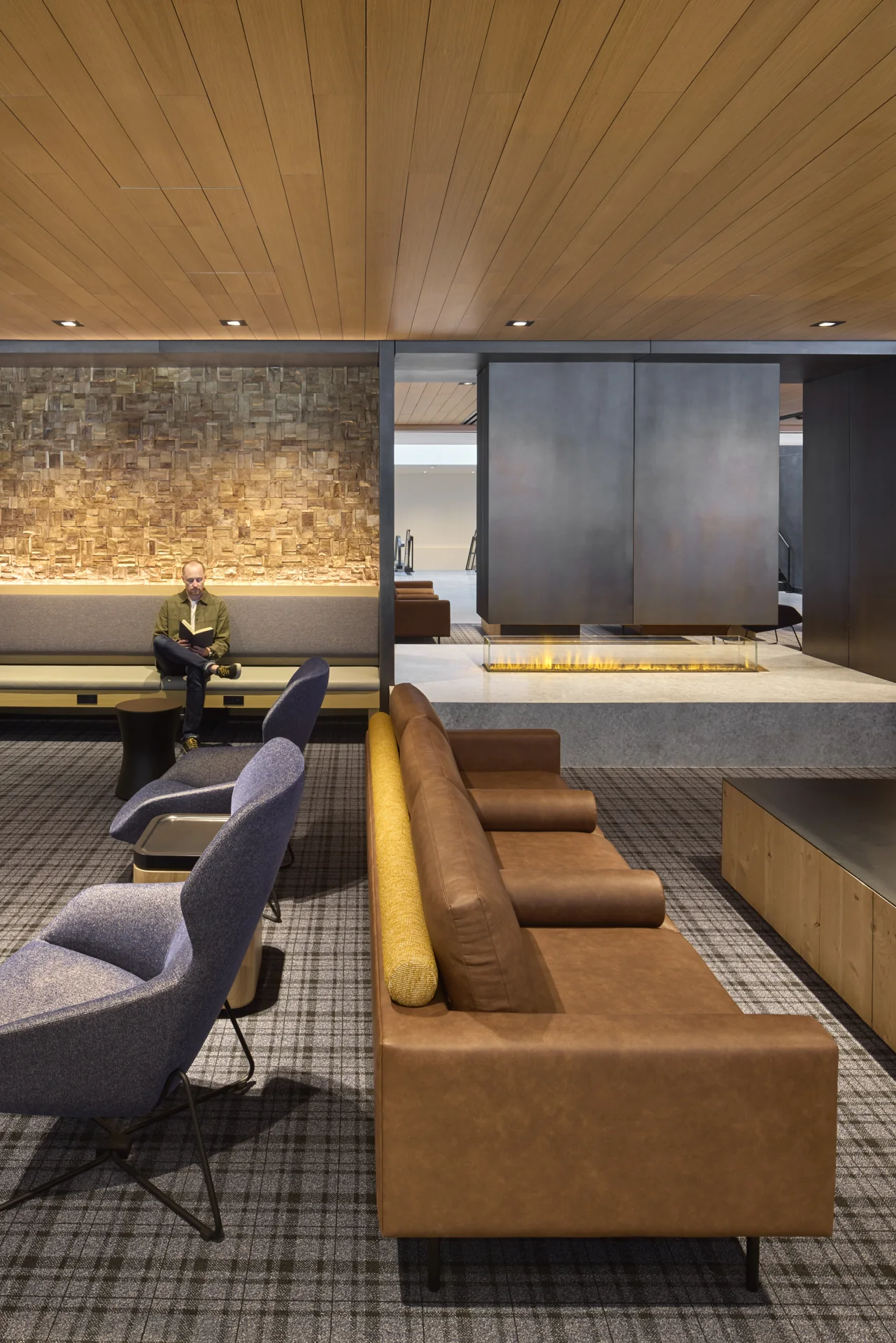 Stone and timber bring warmth to the lounge.