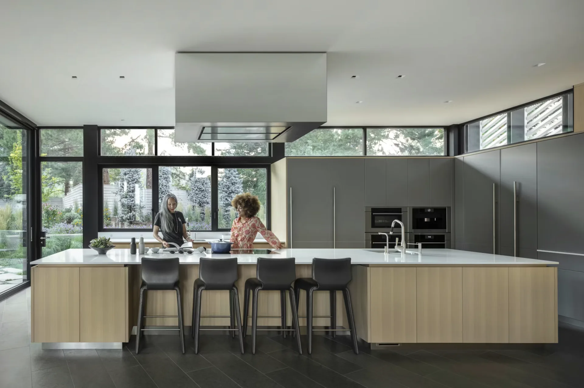 A warm material palette carries through the kitchen.