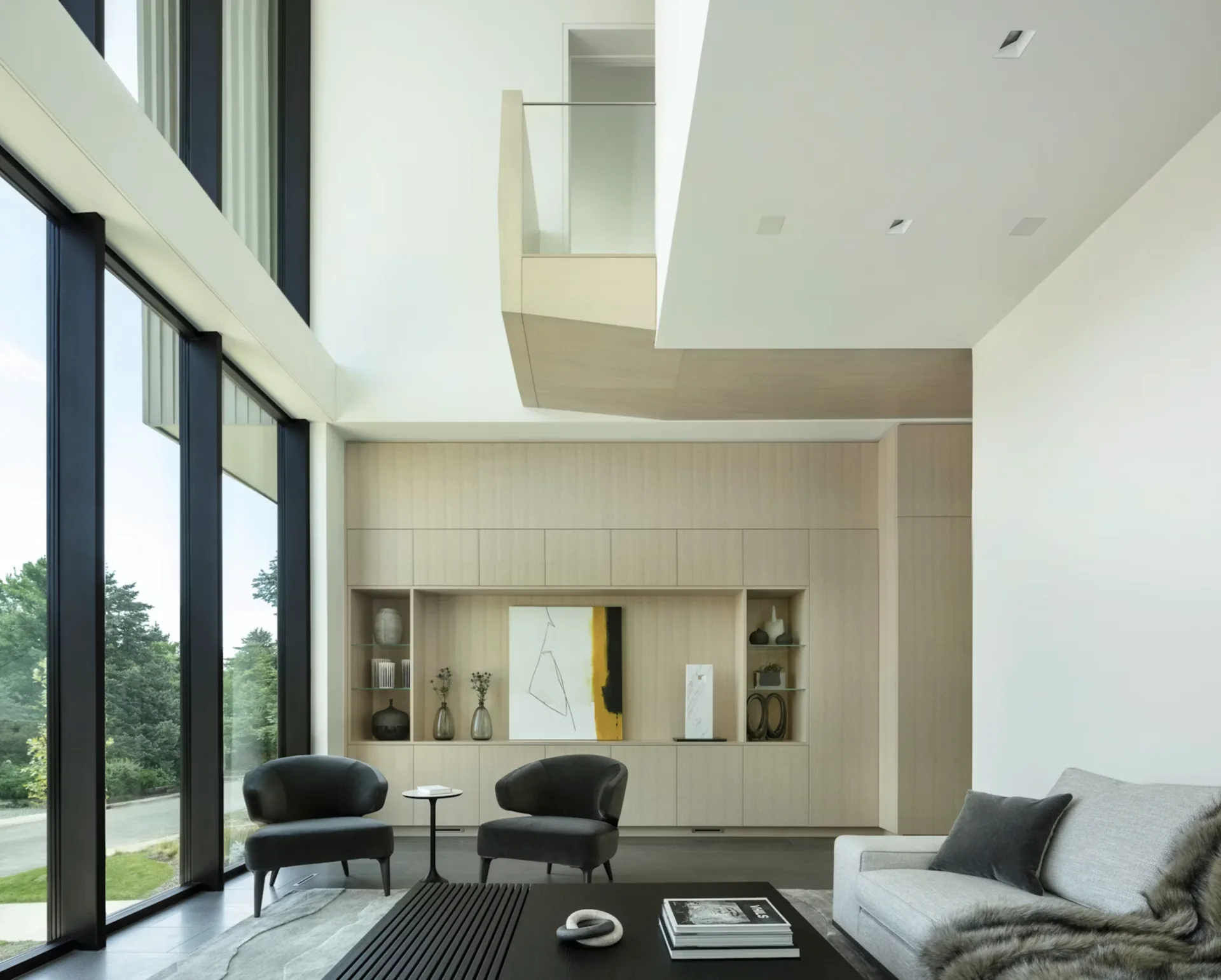 Living space framed by full-height glazing.