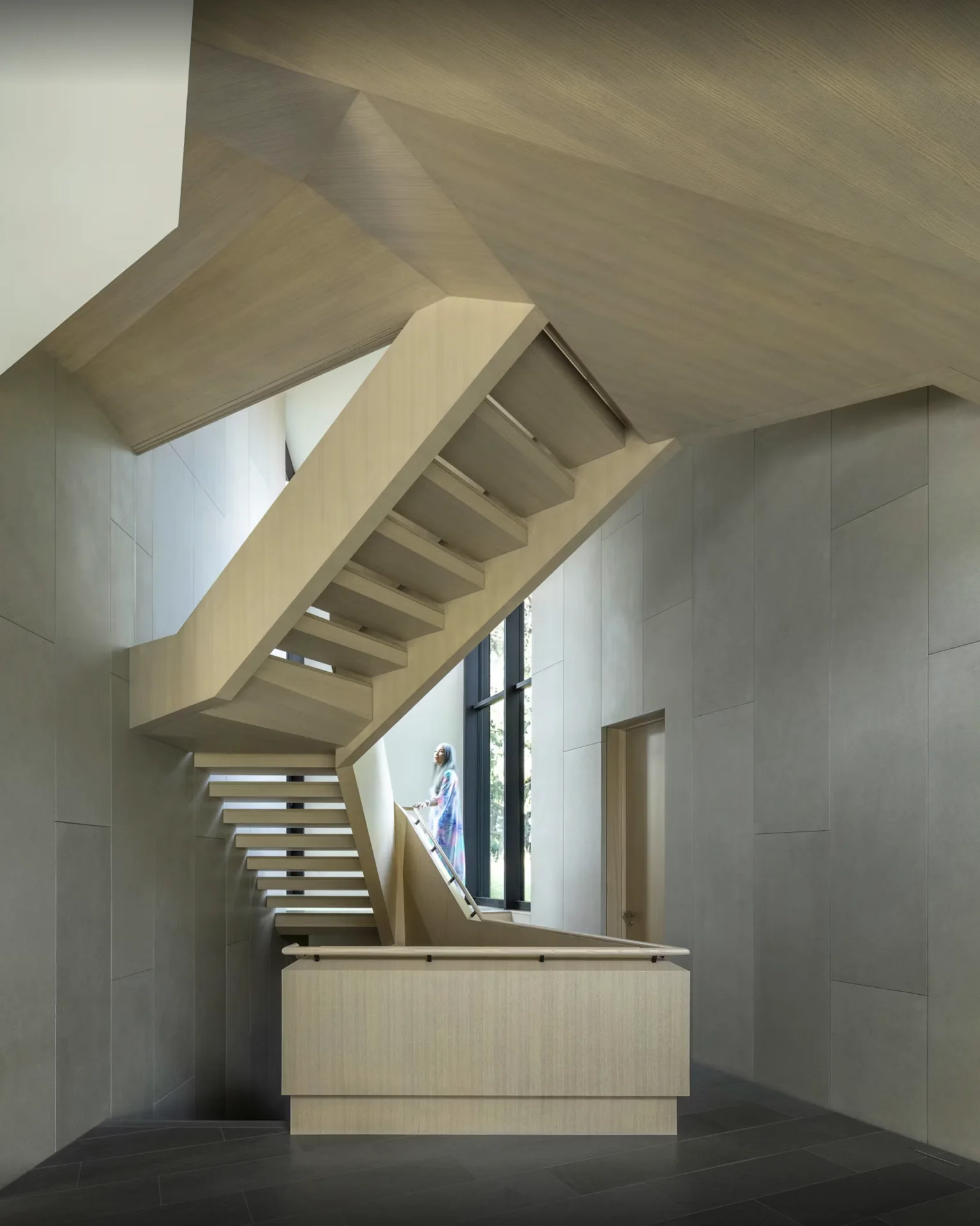 The stair brings movement and light into the center of the home.